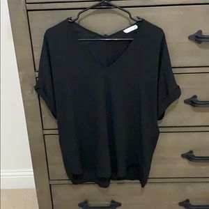 Black polyester v-neck with cuffed sleeves